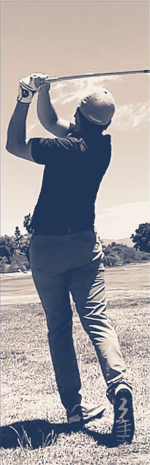 Karl swinging a golf club